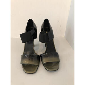 Stylish Patent Leather High Heels with Unique Strap Detail